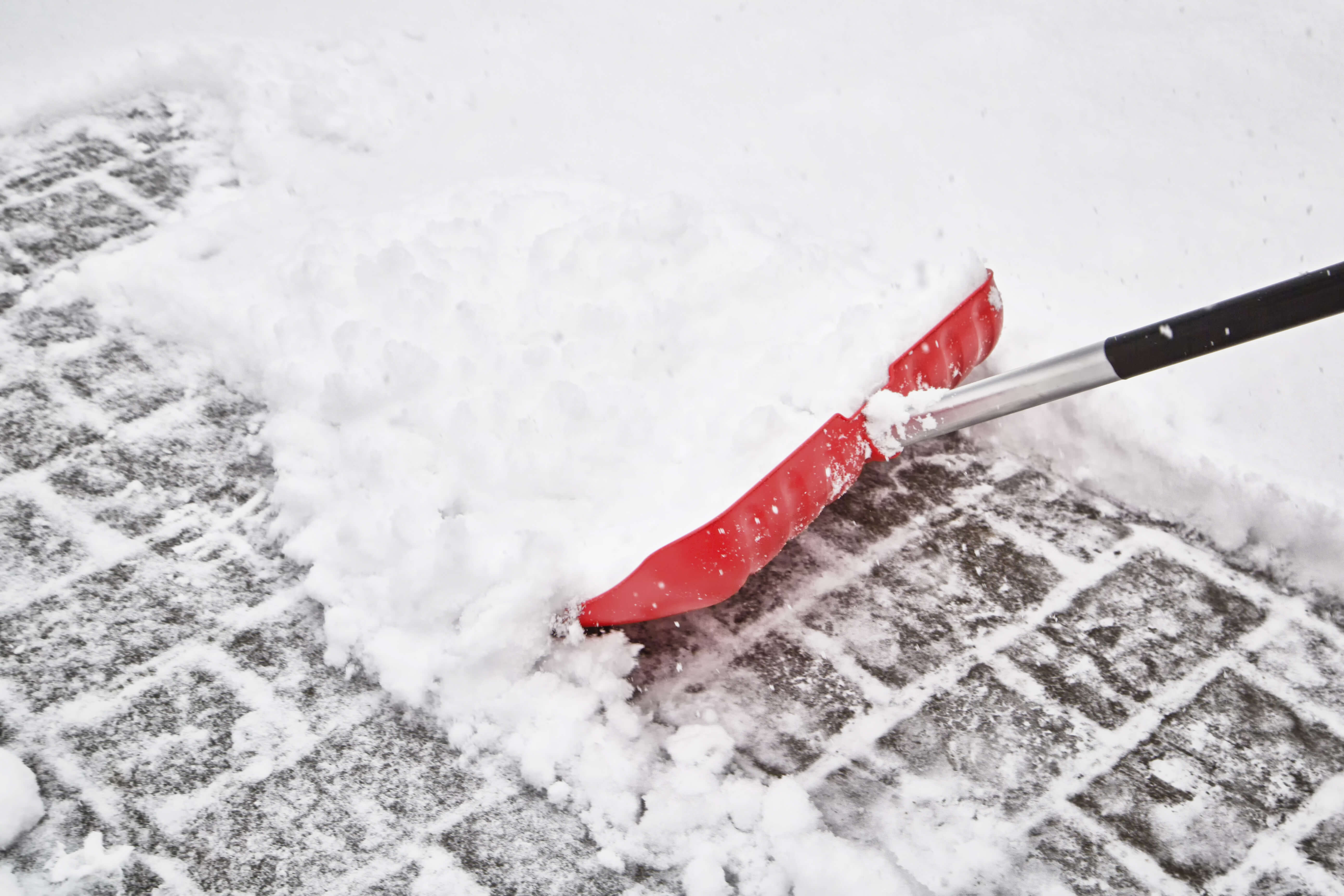 Red blurry snow shovel
